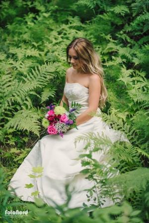 bride in a green forest