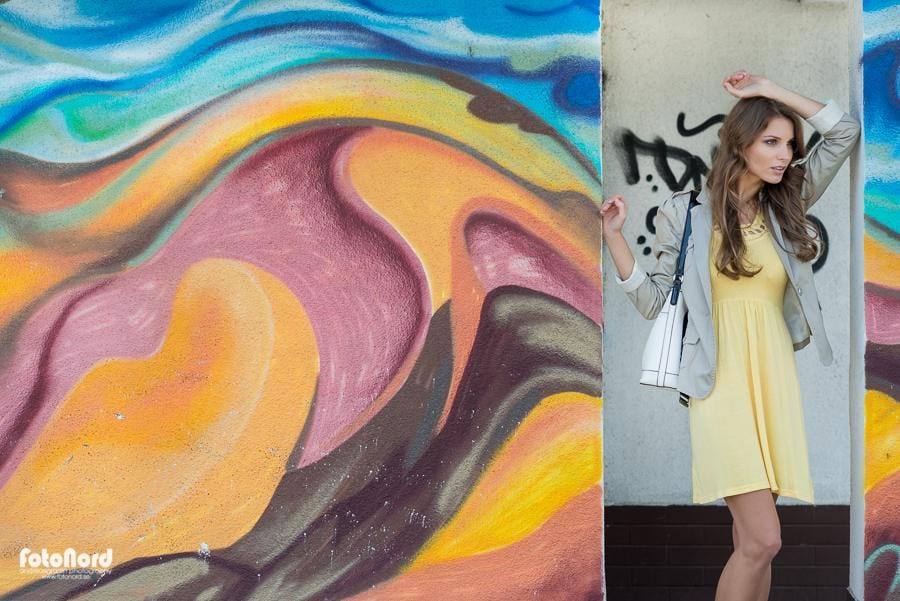 young woman in colorful city setting