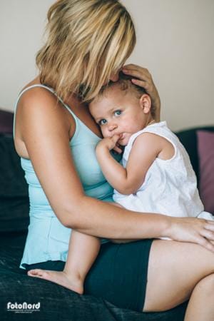Young mother and daughter in a hug