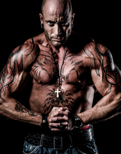a big tattooed bodybuilder with shaved head